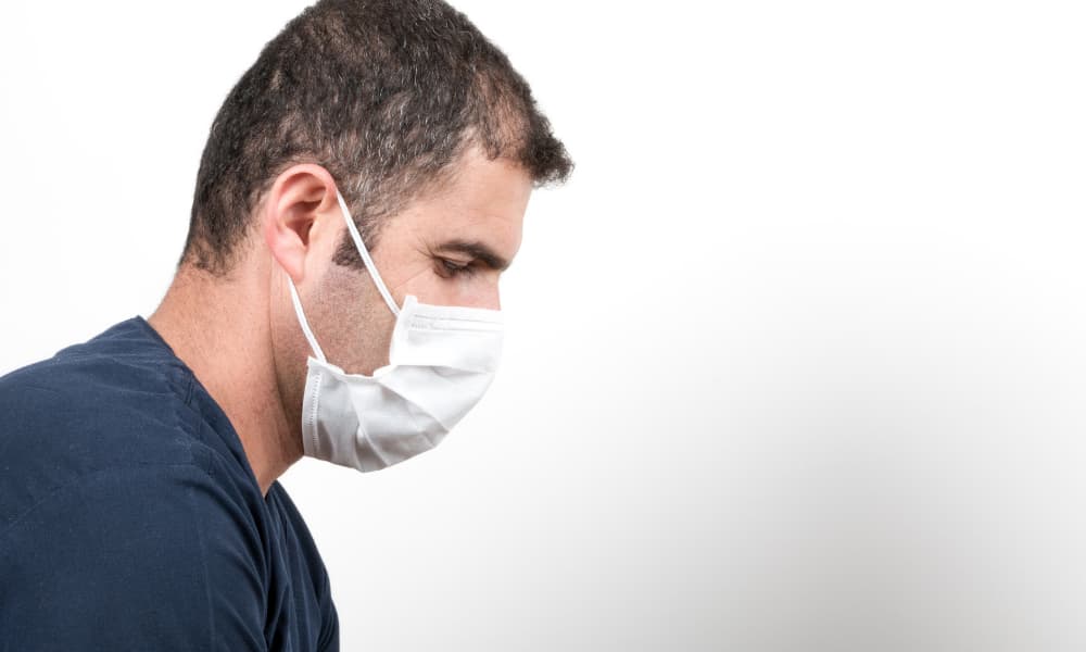 masked medical volunteer dealing with the COVID 19 virus